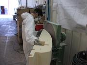 Finishing the sections with lathe-mounted disk sander